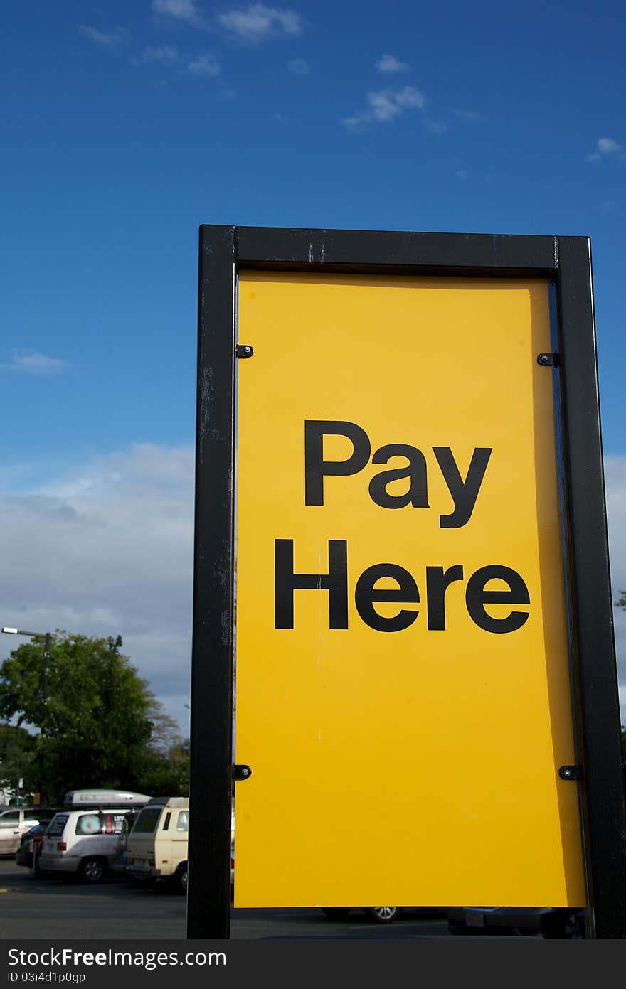 A sign instructing people where to pay. A sign instructing people where to pay