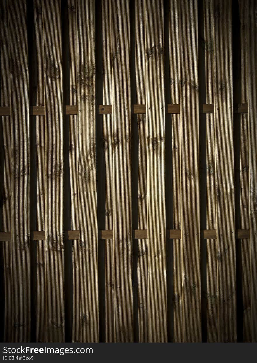 Play of lights on wooden wall