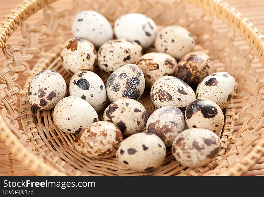 Closeup of quail eggs in a basket