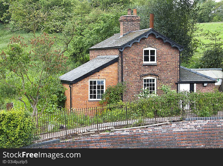 Old traditional English brick built railway cottage.