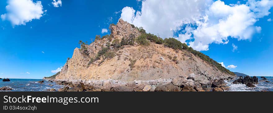 Panorama Of Small Desert Island Among Ocean