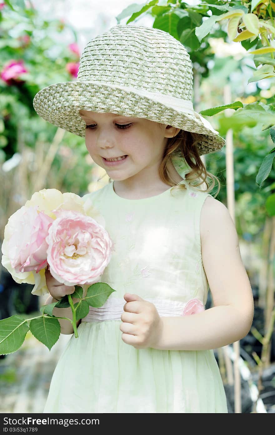 An image of a little girl with big roses