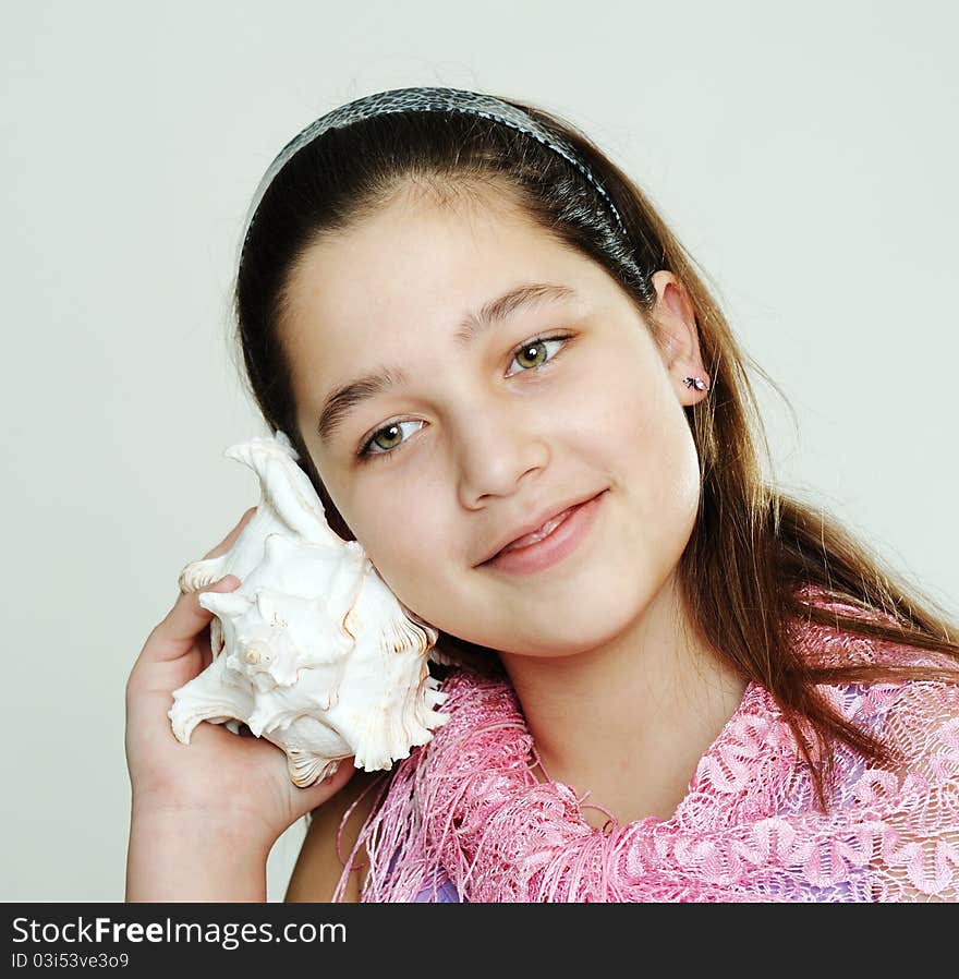 An image of a young girl with a white shell. An image of a young girl with a white shell