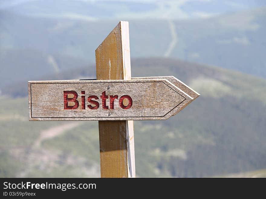 Bistro sign in mountain. Bistro is a small restaurant serving moderately priced simple meals in a modest setting.