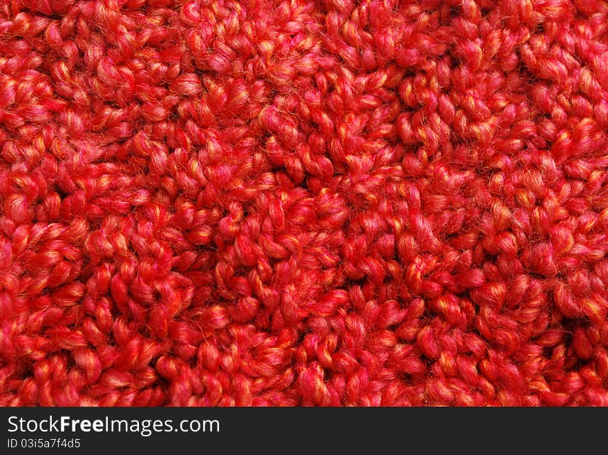 Knitted red orange yarn background. Knitted red orange yarn background