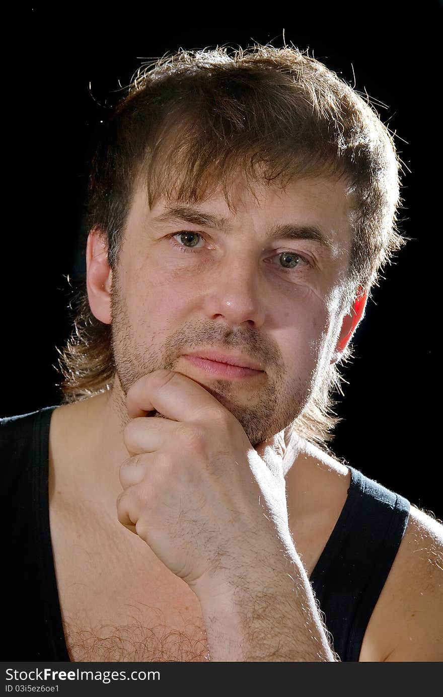 Portrait of the man on a black background