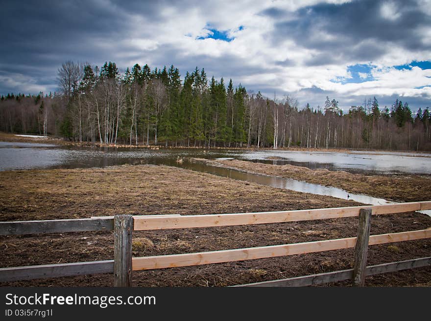 A wooden fence on a field in Sweden