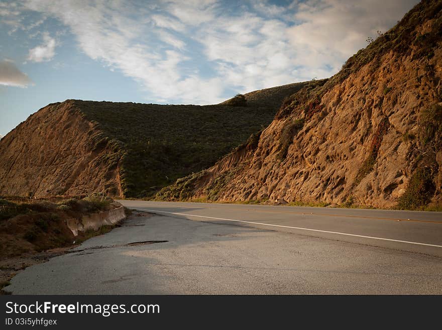 Photo of a mountain and the road on the freeway #1 from San Francisco to Palo Alto in the state of California. Photo of a mountain and the road on the freeway #1 from San Francisco to Palo Alto in the state of California.