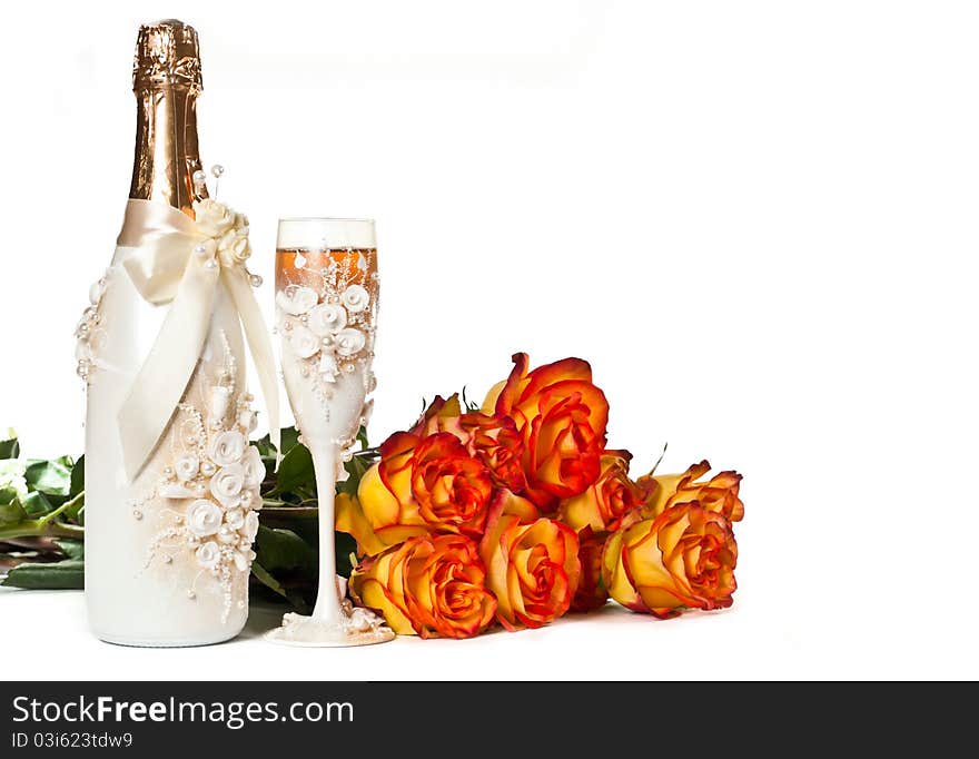 One glass of celebratory champagne with single white rose. One glass of celebratory champagne with single white rose