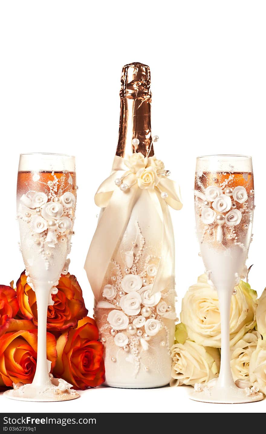 Two glasses of champagne and a roses against white background. Two glasses of champagne and a roses against white background.