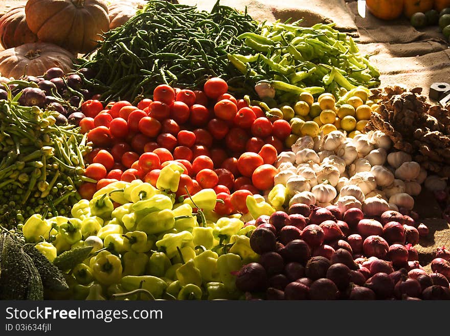 Fresh fruits and vegetables, Tomatoes, onions, garlic, pepperoni on the market in Colombi. Fresh fruits and vegetables, Tomatoes, onions, garlic, pepperoni on the market in Colombi