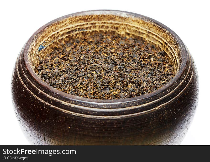 Black Tea Isolated On White In Wooden Bowl