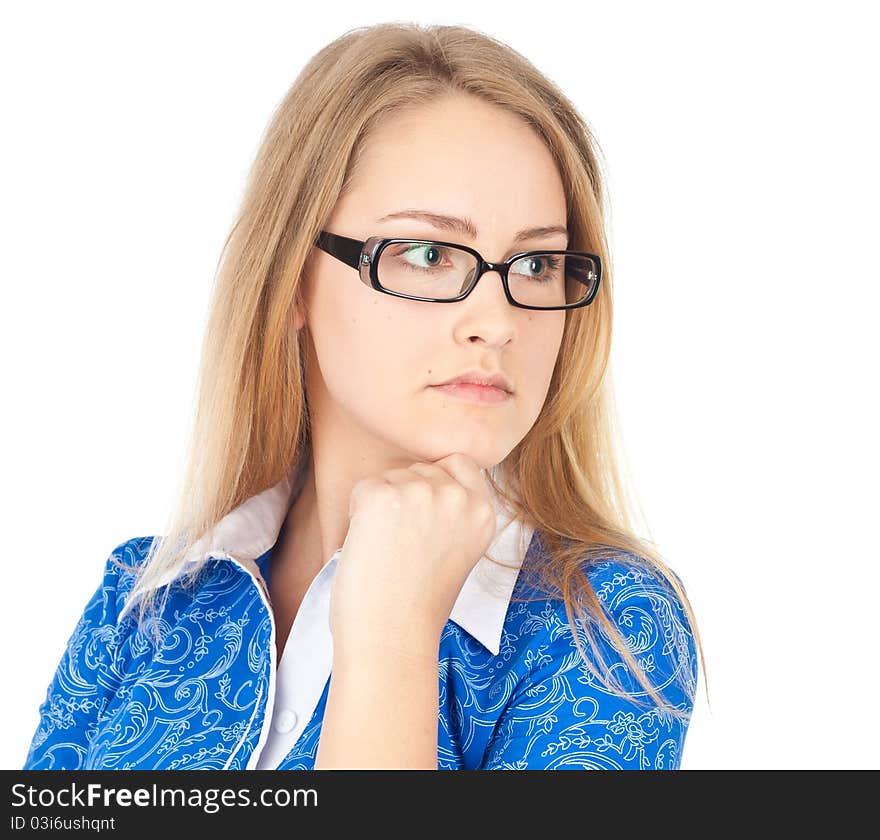 Young business woman in glasses sitting thinking. Young business woman in glasses sitting thinking