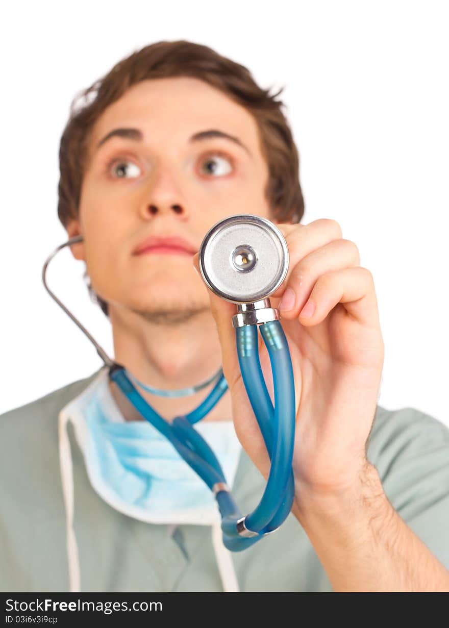 Young doctor listening to stethoscope close up. Selective focus.