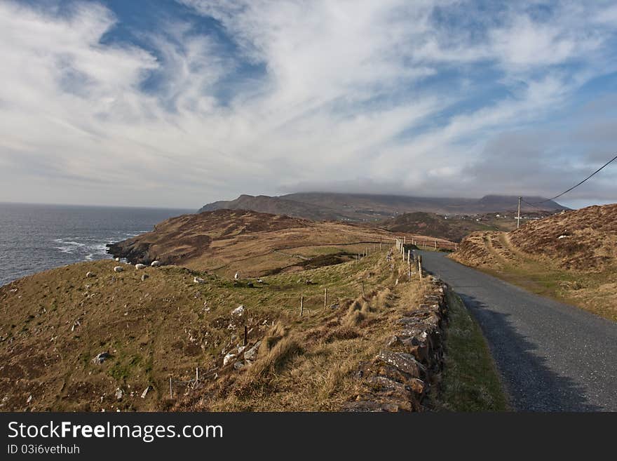 An morning view of winding roads through the mountains of Ireland. An morning view of winding roads through the mountains of Ireland