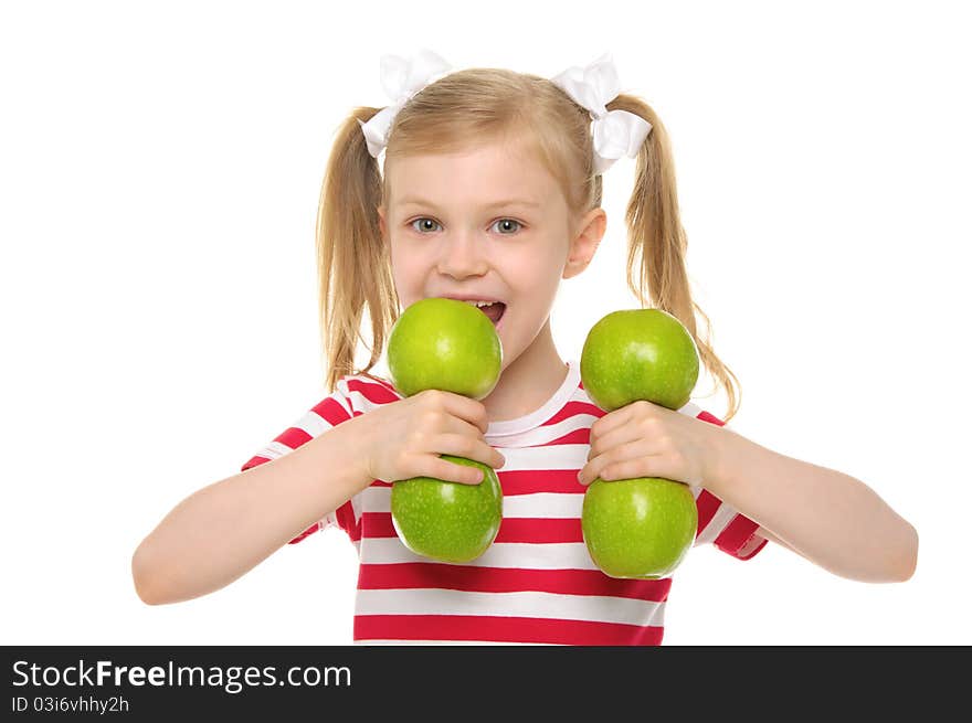 Girl bites dumbbell from apples isolated on white