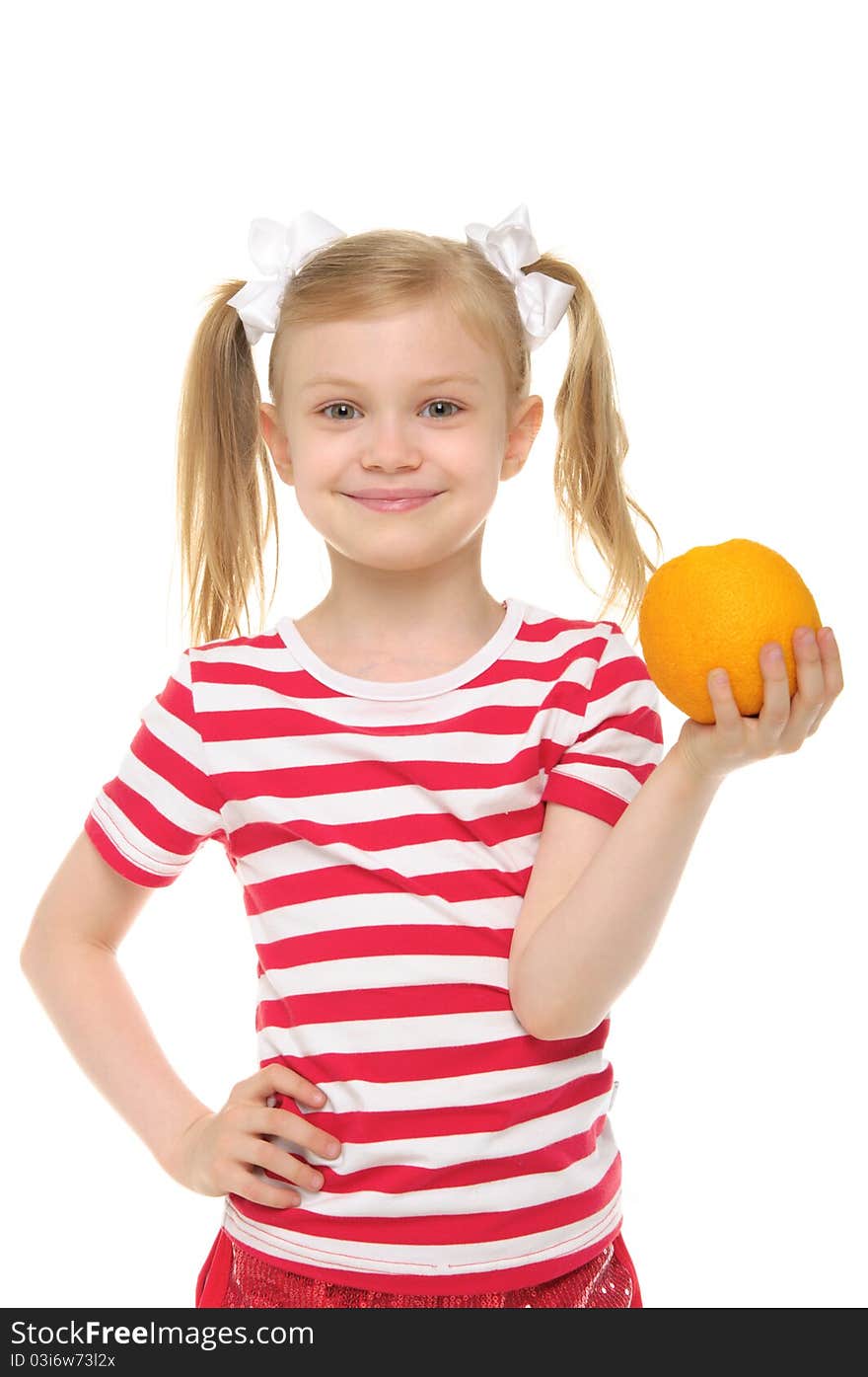 Girl holding an orange and smiling isolated on white