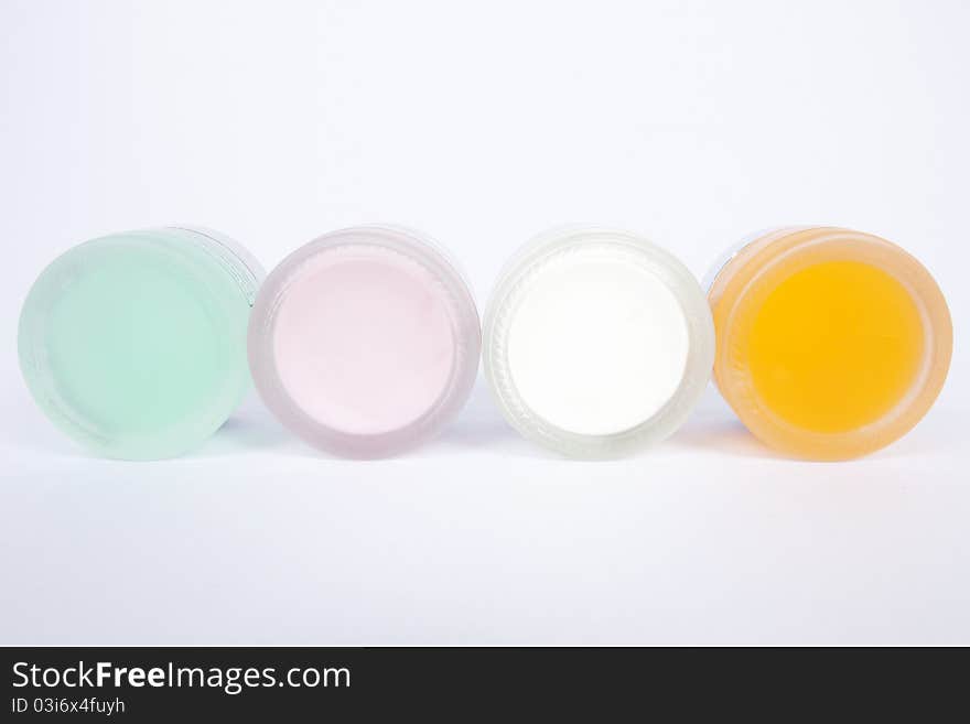 Four pot of cosmetic cream, colorful. Four pot of cosmetic cream, colorful.