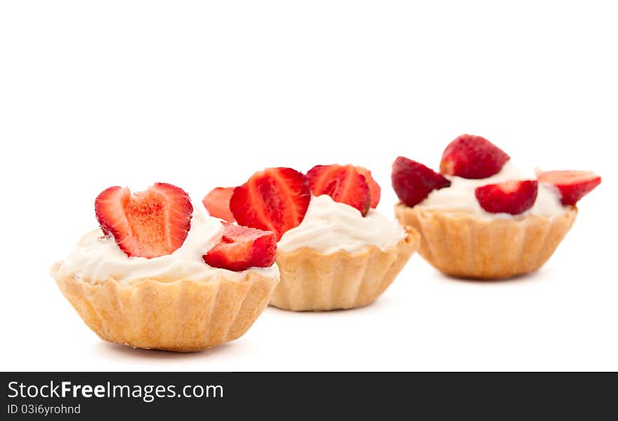 Strawberries and cream in a basket on a white background