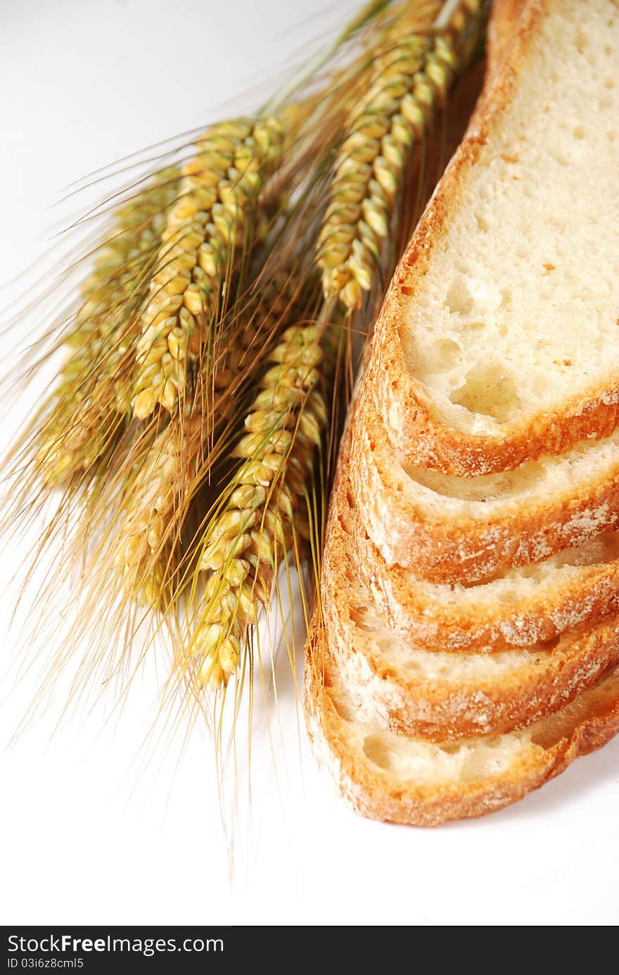 Slices of bread and ears on white background. Slices of bread and ears on white background