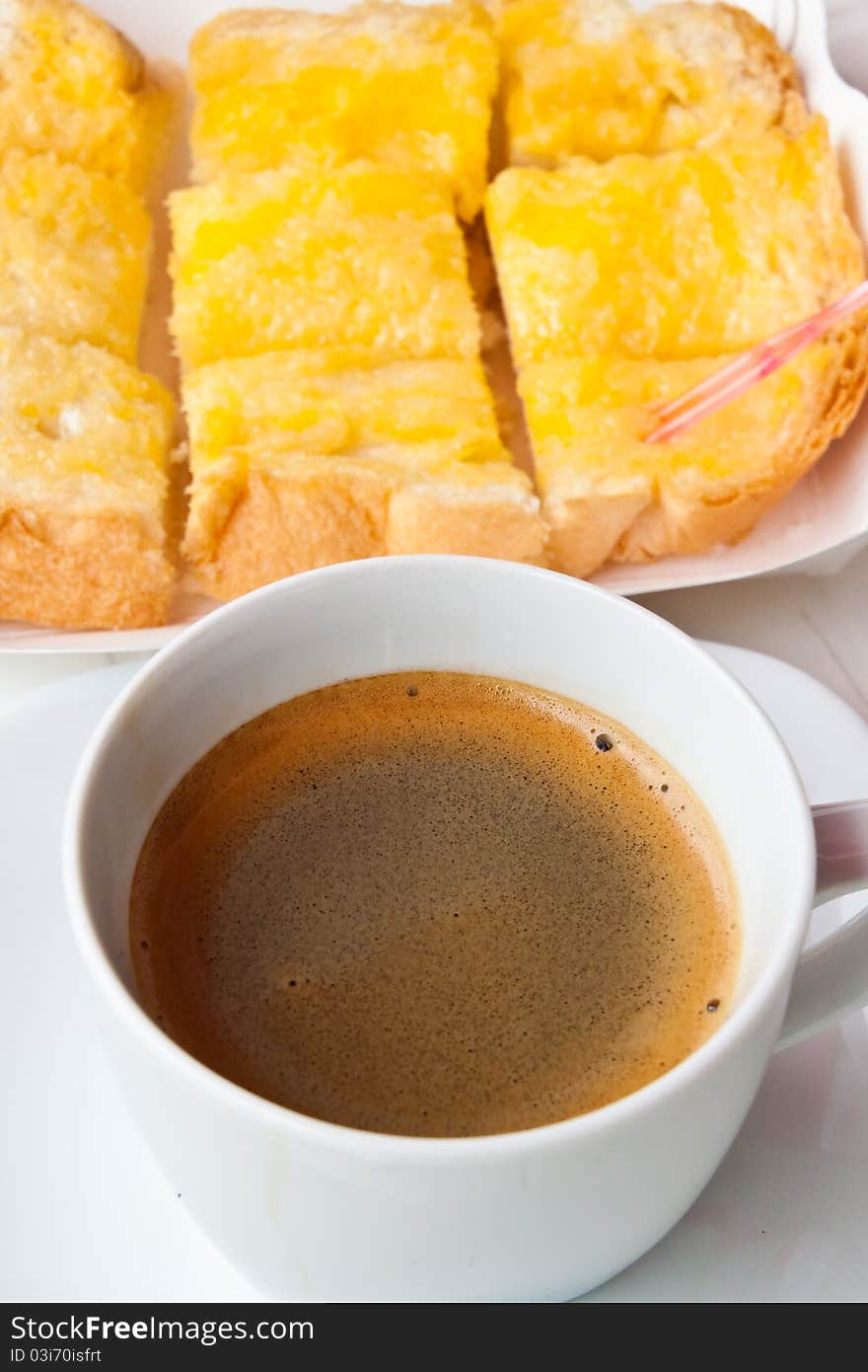 Breakfast with coffee and bread on the table