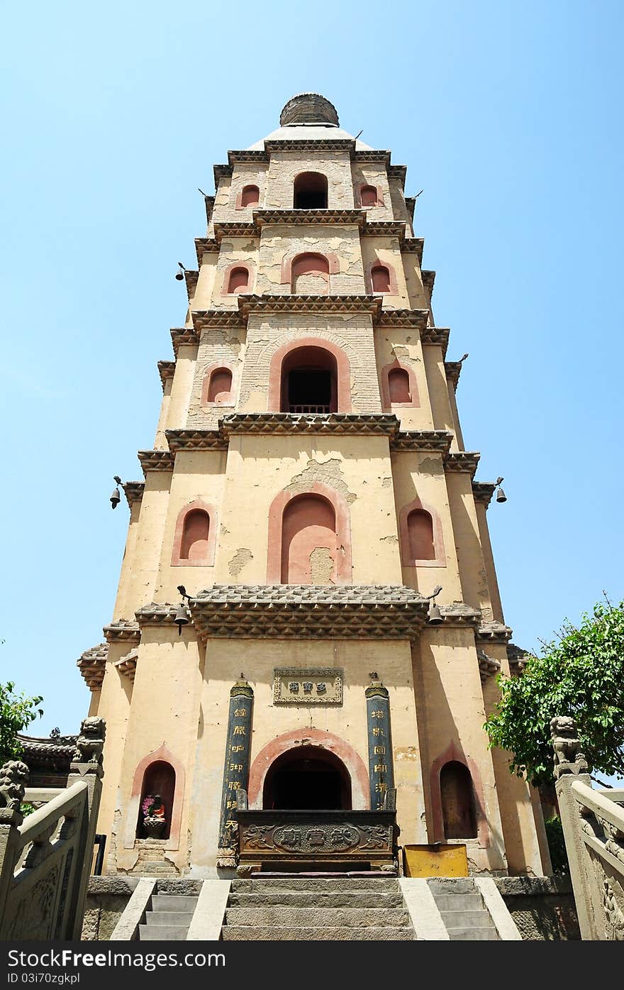 Bottom view of an ancient Chinese pagoda against blue sky. Bottom view of an ancient Chinese pagoda against blue sky