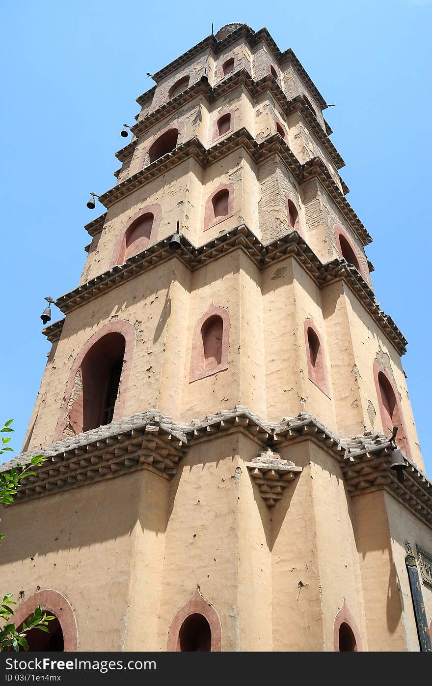 Bottom view of an ancient Chinese pagoda against blue sky. Bottom view of an ancient Chinese pagoda against blue sky