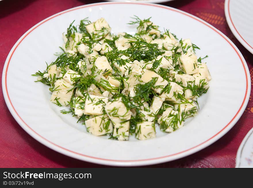 Cheese with dill in a bowl