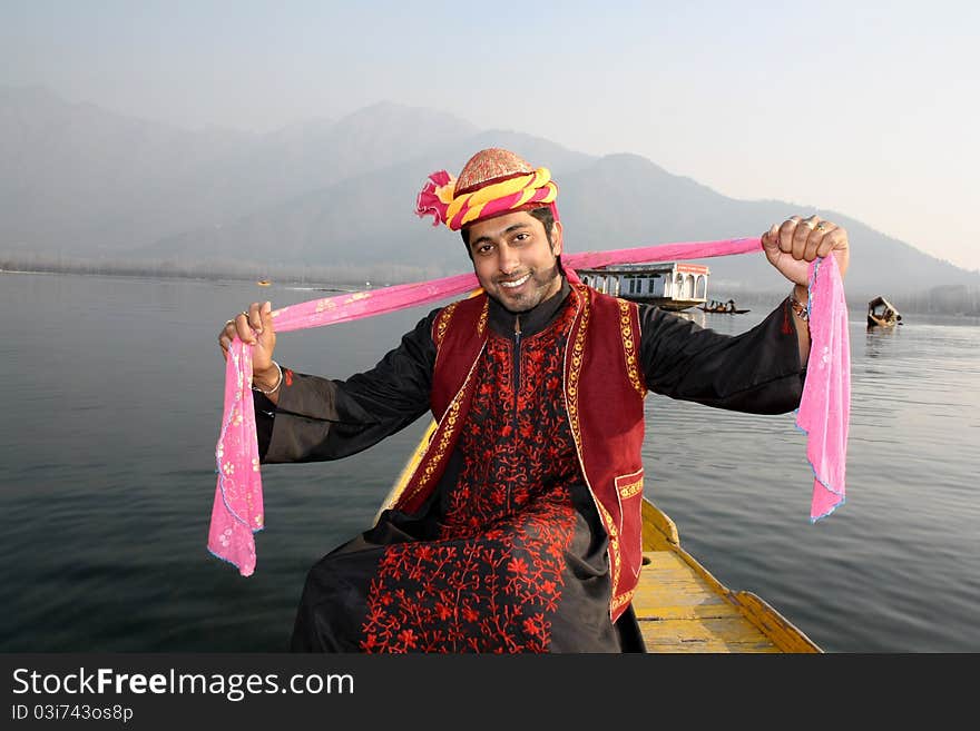 Indian Man Dancing to Folk Song with Pink Shawl