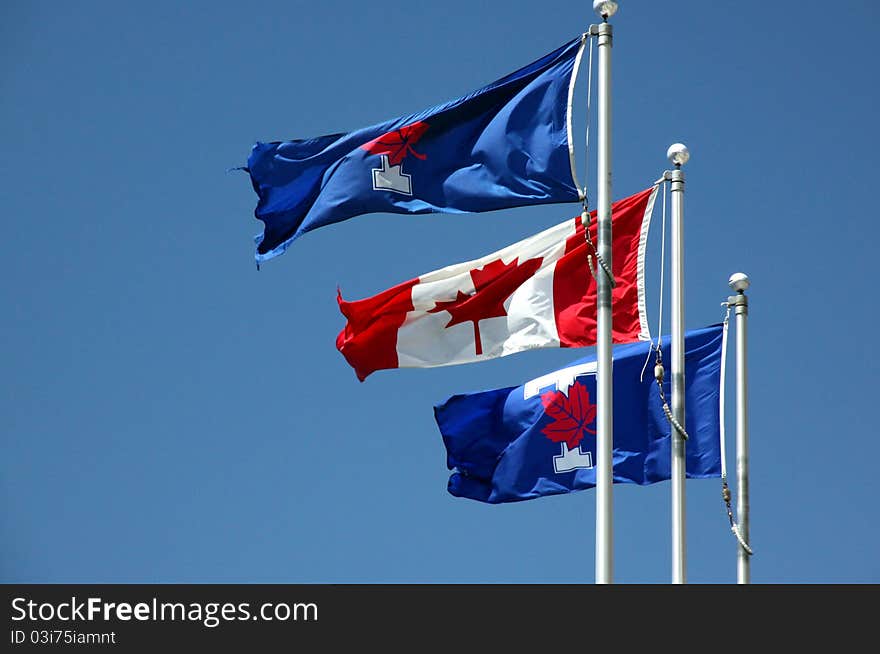 A Canadian flag in a sunny day