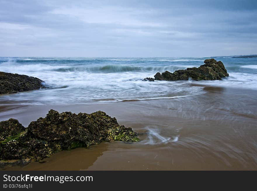 Lonly beach and waves at sunset. Lonly beach and waves at sunset