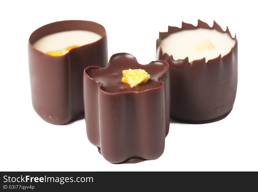 Closeup view of chocolate candies over white background