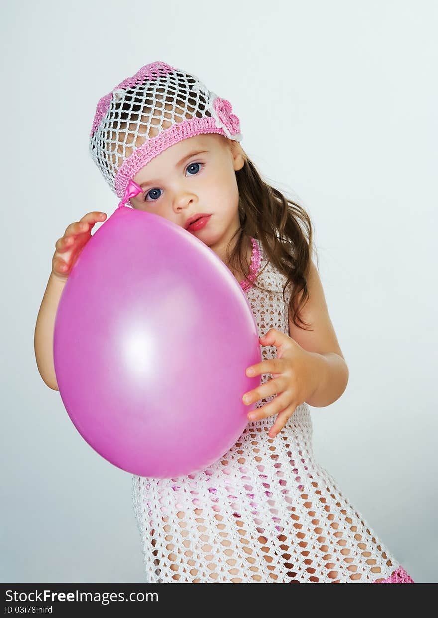 Small child with colorful balloons in the studio. Small child with colorful balloons in the studio