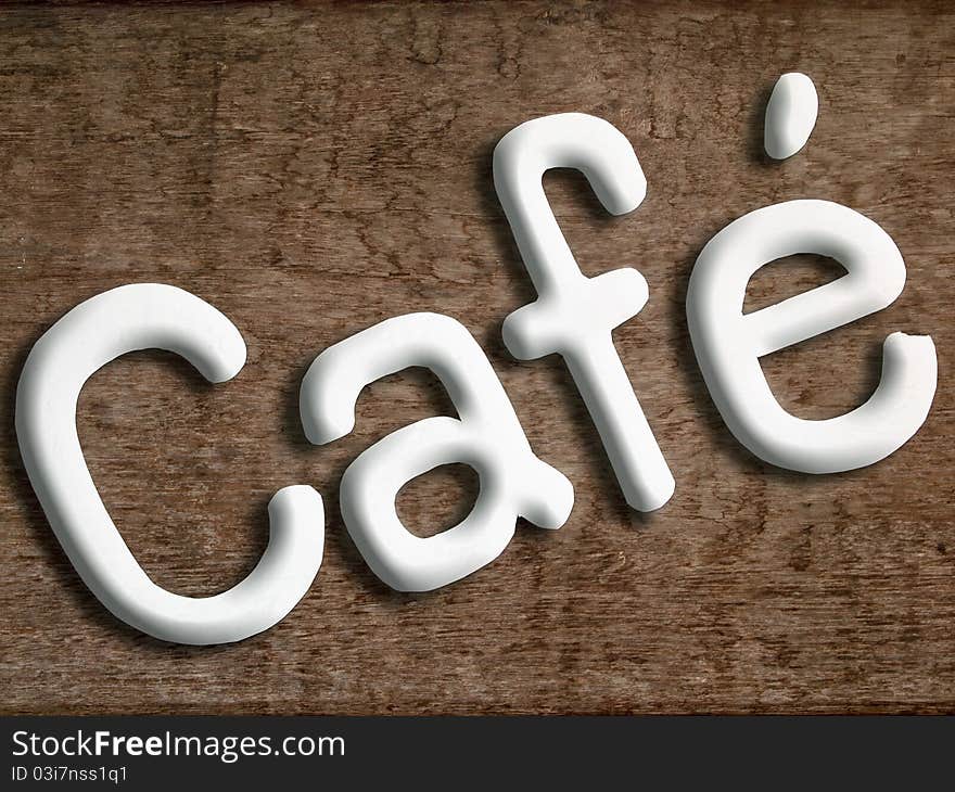 Cafe white letters on a wood background and shadow