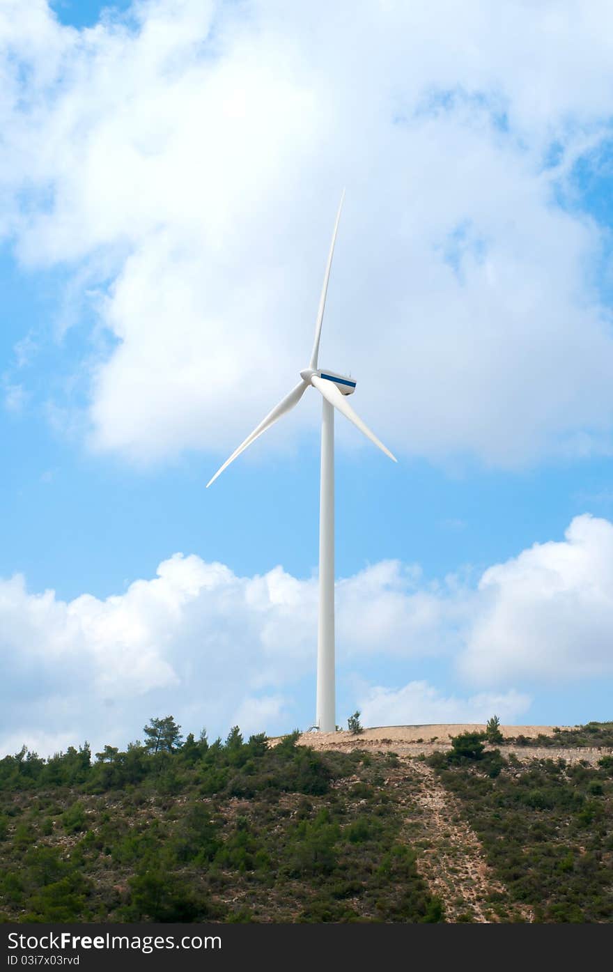 Wind mill power generator. Vertical landscape image