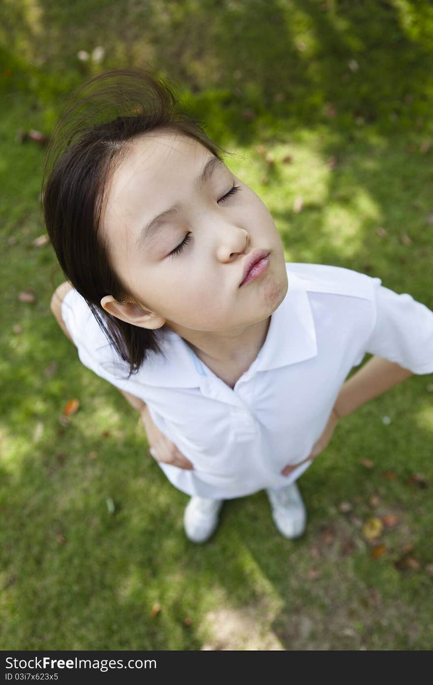 10-year old asian girl, shot from above with wide angle lens. 10-year old asian girl, shot from above with wide angle lens.