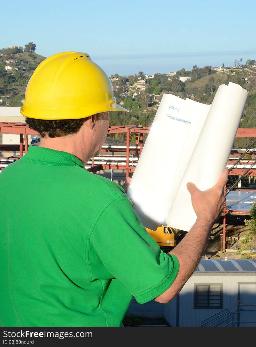 Supervisor inspecting the comstruction project. Supervisor inspecting the comstruction project