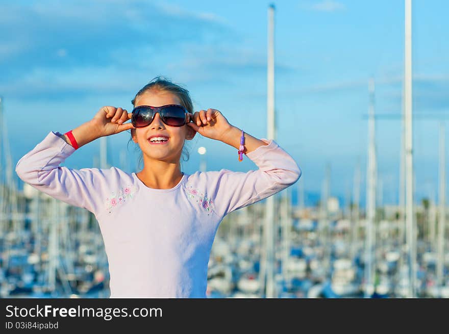 Portrait of a girl in the background of yachts