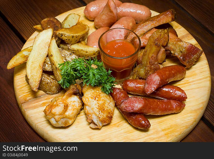 Sausage meat on wooden plate. Sausage meat on wooden plate