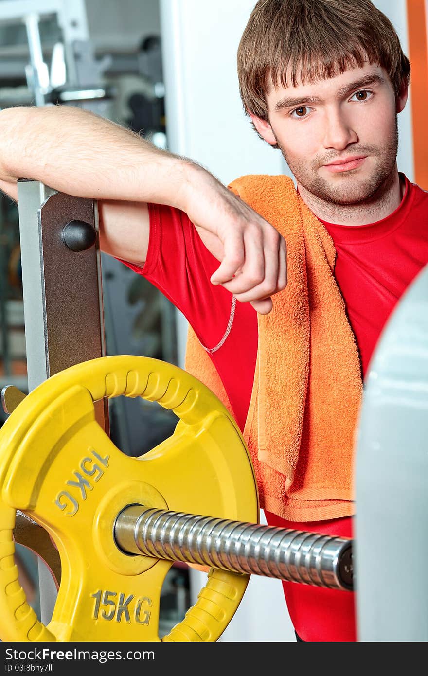 Handsome young man in the gym centre. Handsome young man in the gym centre.