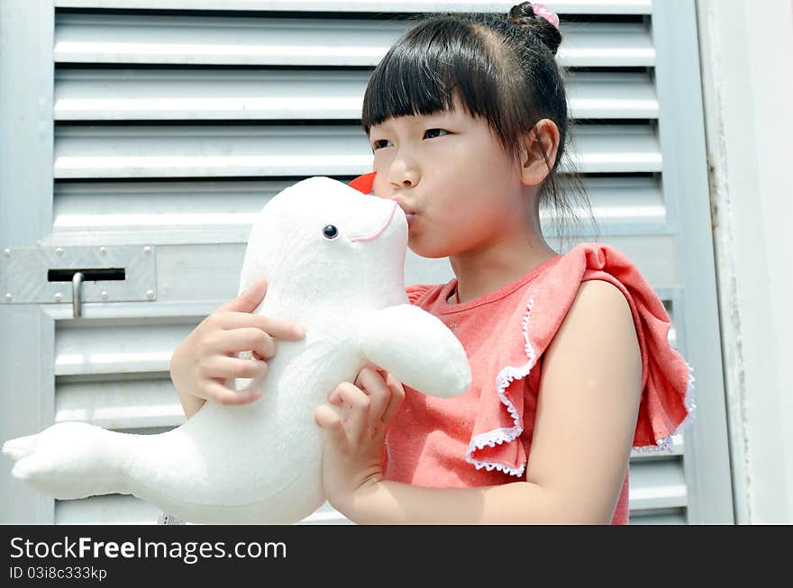 Asian child kiss the Dolphin