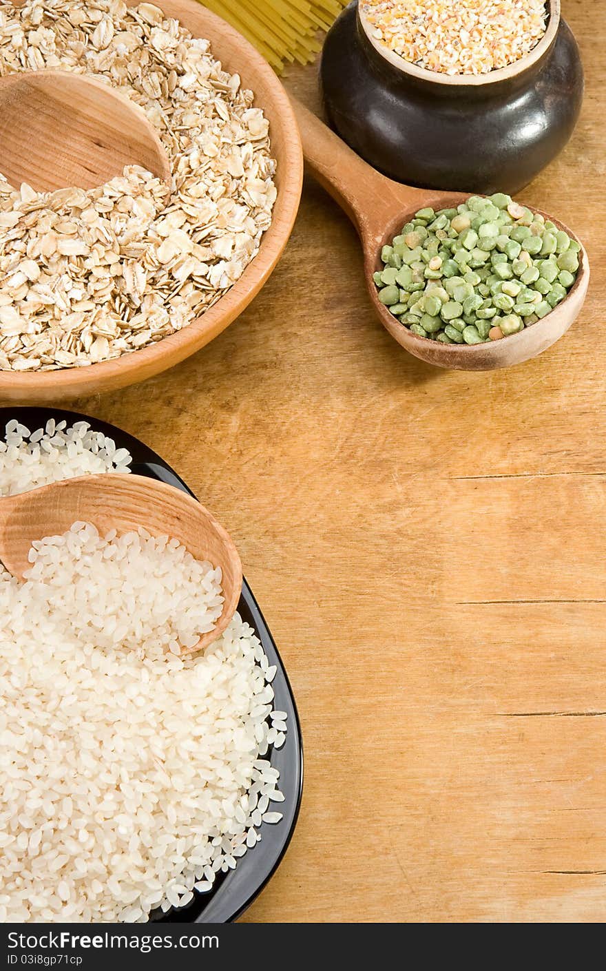 Rice, pea, spaghetti and oat in plate on table