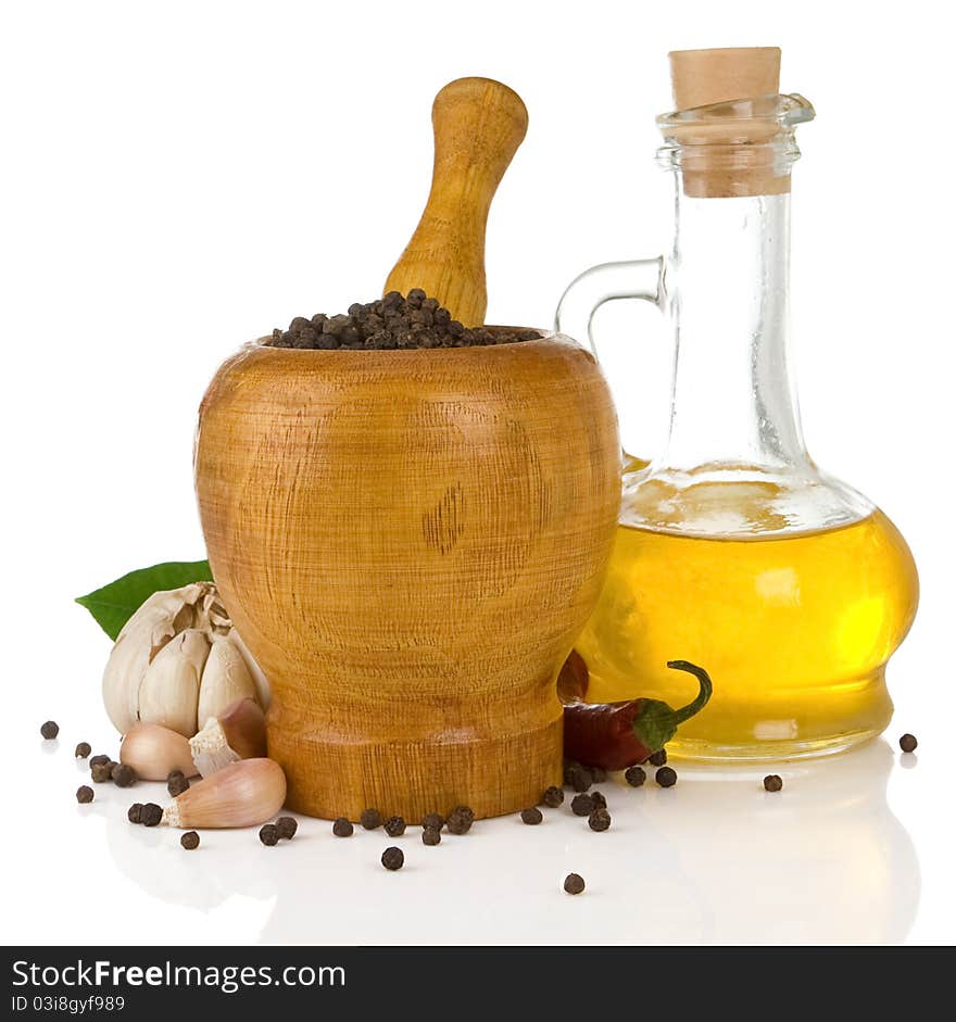 Garlic, onion and pepper in mortar and pestle isolated on white background. Garlic, onion and pepper in mortar and pestle isolated on white background