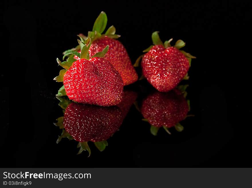 Red strawberry isolated on black. Red strawberry isolated on black