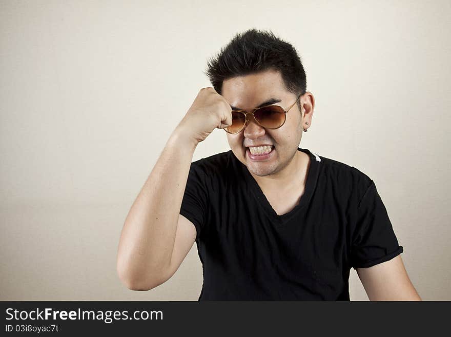 A man wearing sunglasses with expression pose, confident. A man wearing sunglasses with expression pose, confident.