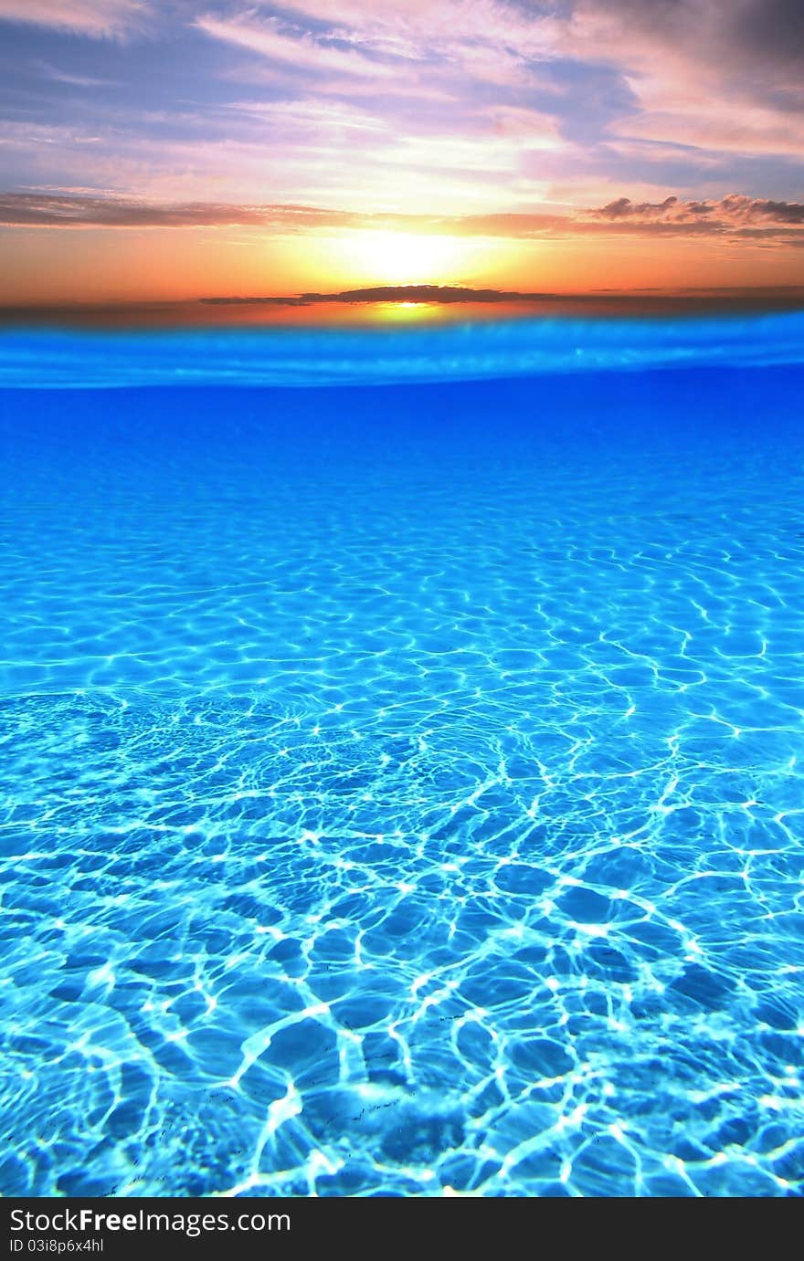 Sunset over blue swimming pool. Sunset over blue swimming pool