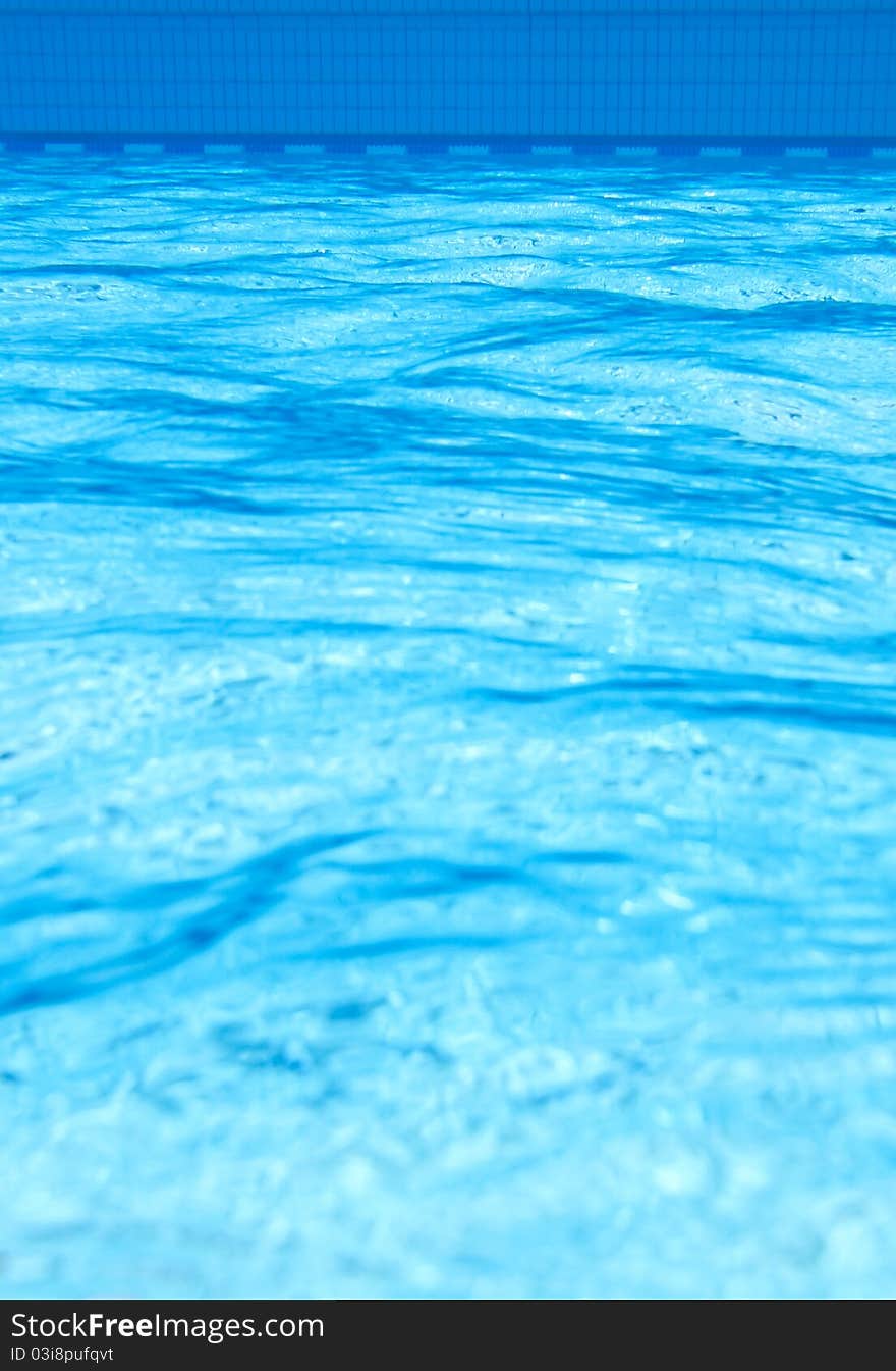 Ripples in blue pool in under water view