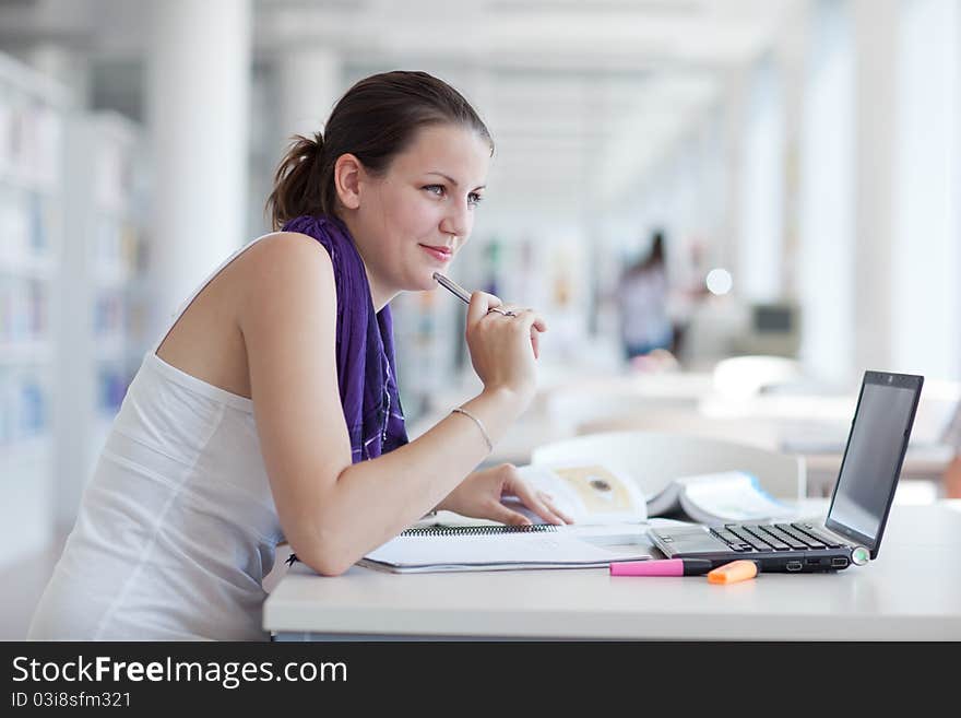 Pretty Female Student With Laptop