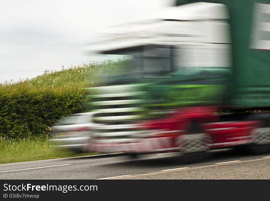 Lorry and car speeding on road. Lorry and car speeding on road