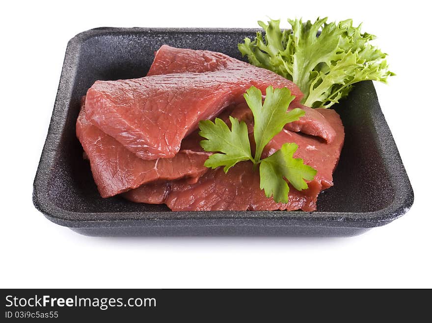 Raw beef frying steak in black tray isolated over white background. Raw beef frying steak in black tray isolated over white background